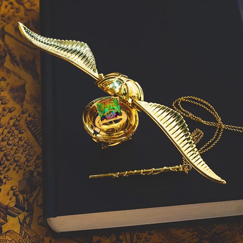 Golden Snitch ring box with gold plated wings open showing the velvet ring insert for a Harry Potter proposal