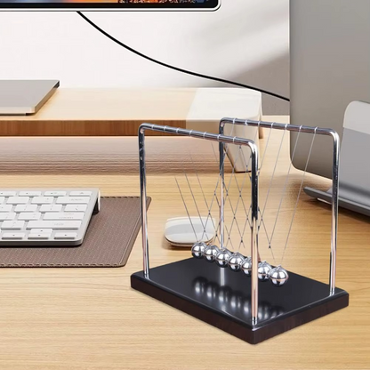 Newton's Cradle physics pendulum desk toy with steel balls demonstrating momentum and energy laws