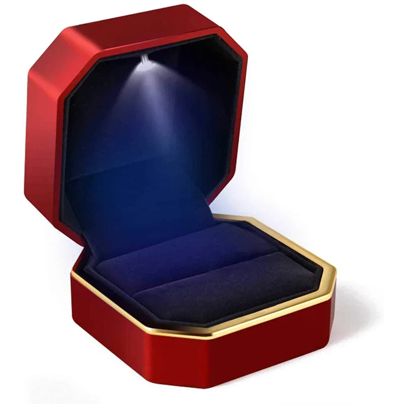 Red and gold jewelry box with a blue interior LED ring box with automatic light for engagement proposals and wedding jewelry display