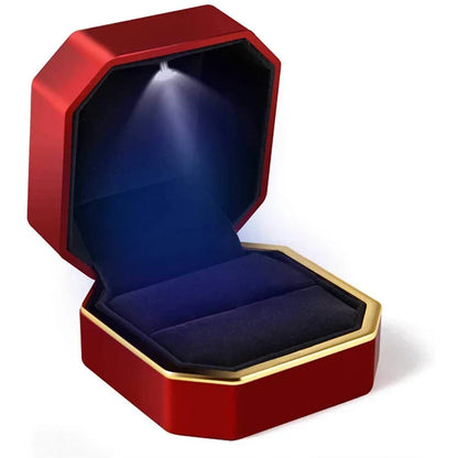 Red and gold jewelry box with a blue interior LED ring box with automatic light for engagement proposals and wedding jewelry display