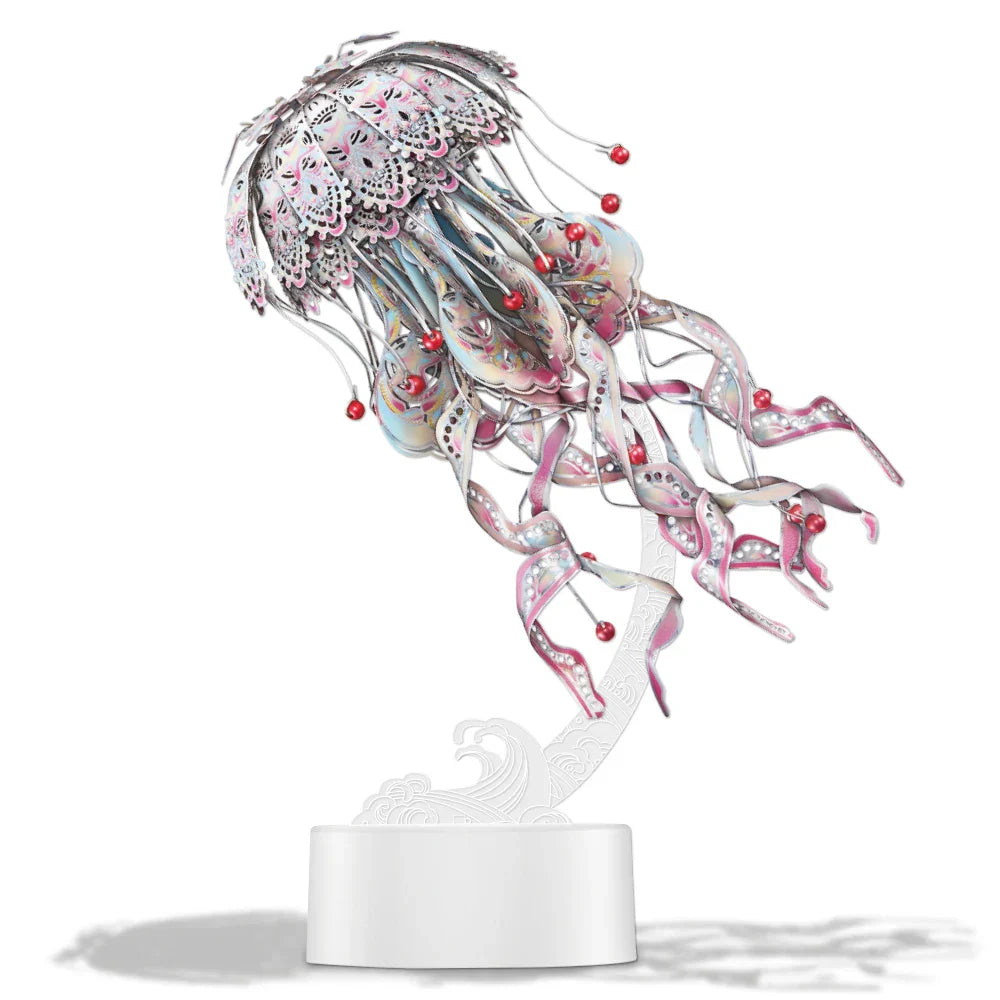 Decorative jellyfish sculpture with pink and silver details on a white base.