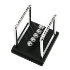 Newton's Cradle physics pendulum desk toy with steel balls demonstrating momentum and energy laws