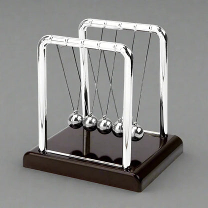 Newton's Cradle physics pendulum desk toy with steel balls demonstrating momentum and energy laws