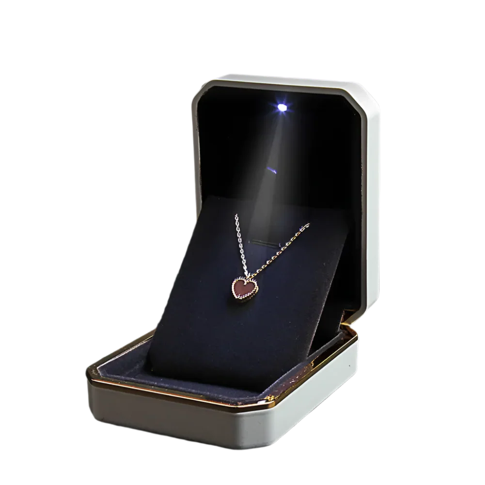 Jewelry box with a heart-shaped pendant inside LED ring box with automatic light for engagement proposals and wedding jewelry display