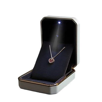 Jewelry box with a heart-shaped pendant inside LED ring box with automatic light for engagement proposals and wedding jewelry display