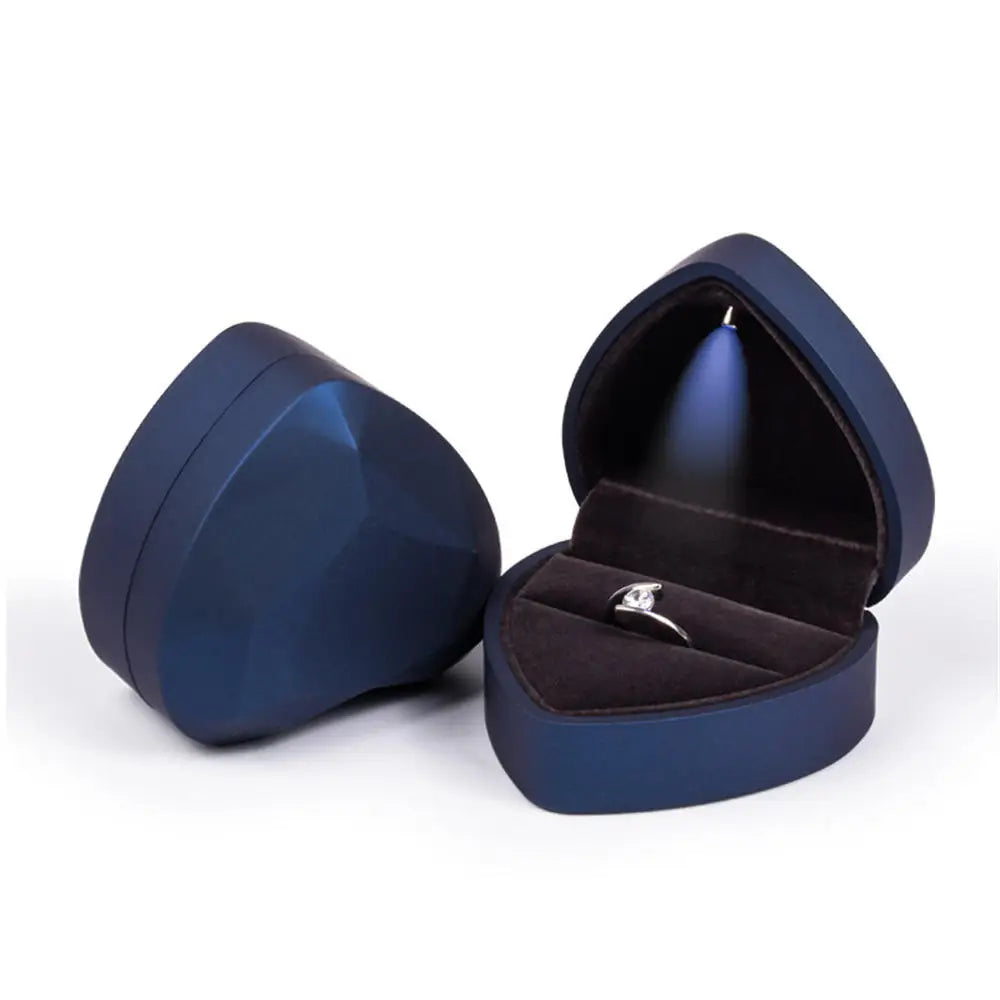 Navy blue jewelry box with a ring inside LED ring box with automatic light for engagement proposals and wedding jewelry display