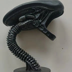 Black alien head with a long neck on a white background -Unique alien creature resin lamp stand for modern home decor