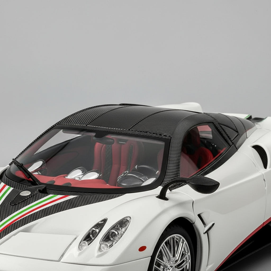 Detailed cockpit of a 1:18 Pagani Huayra model with chrome dashboard dials, carbon trim and tricolore stripe for fans, White