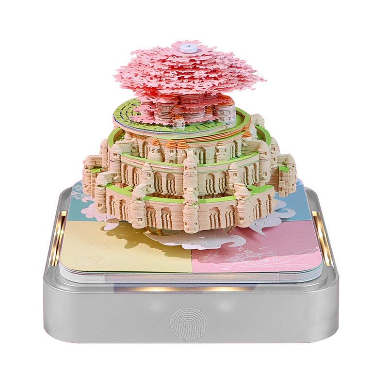 3D paper sculpture note pad building a Santorini scene page by page, a touch LED base and desk calendar for the office