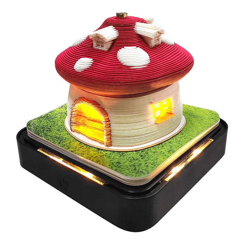 Layered paper sculpture memo pad revealing a castle scene, the Castle 1 design with a touch LED base and built-in calendar