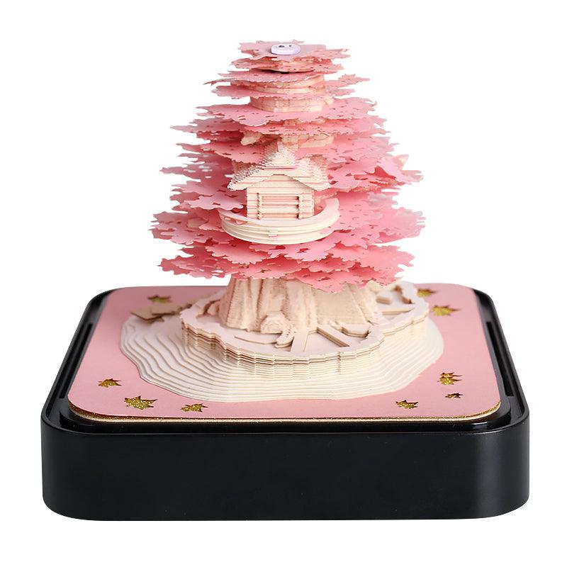 Office desk gift memo pad forming a Green Treehouse paper sculpture, with tear-away note pages, an LED base and calendar