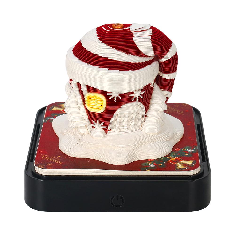Desk ornament memo pad forming a Carousel paper sculpture as pages tear off, a glowing LED base and built-in desk calendar