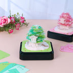 Tear-away memo pad revealing a Castle Garden paper sculpture, a creative LED desk ornament and calendar for the workspace