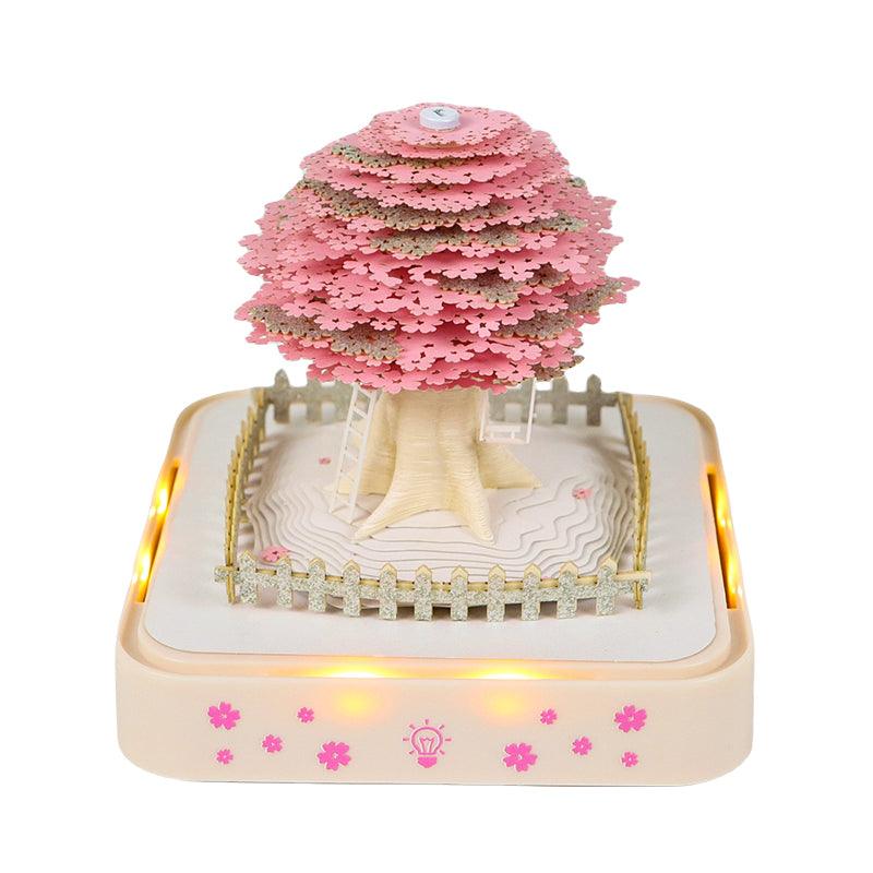 Tear-off memo pad forming a Christmas paper sculpture, a festive LED desk ornament and calendar gift for the workspace