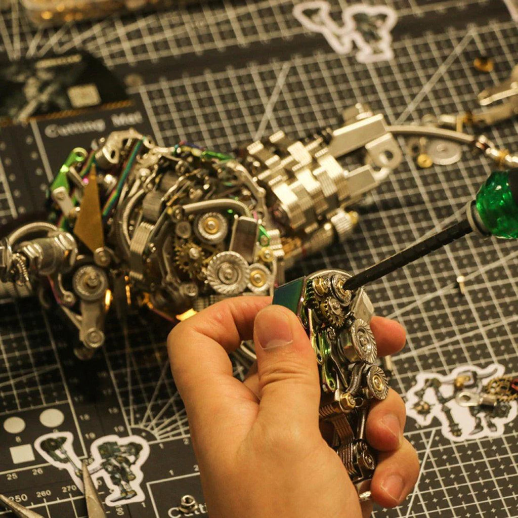 Assembling a stainless steel mechanical bull from numbered metal parts, a glue free building kit and project for adult makers Silver
