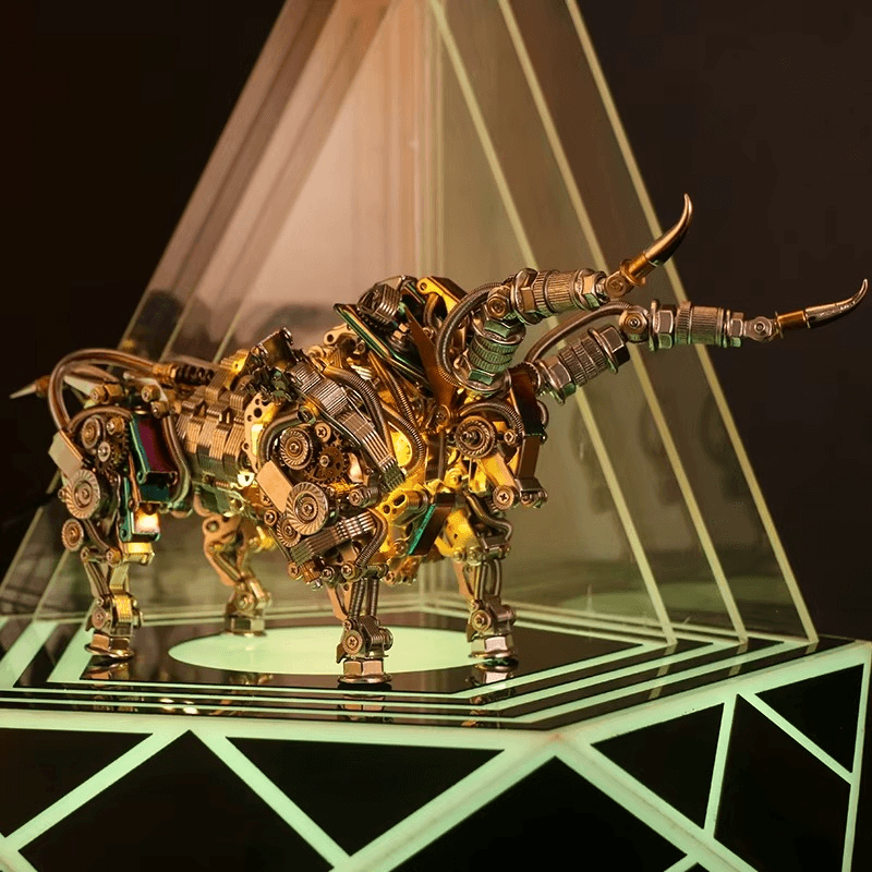 Mechanical bull model in a warm gold finish lit under a spotlight, an articulated metal animal sculpture and display centerpiece Gold