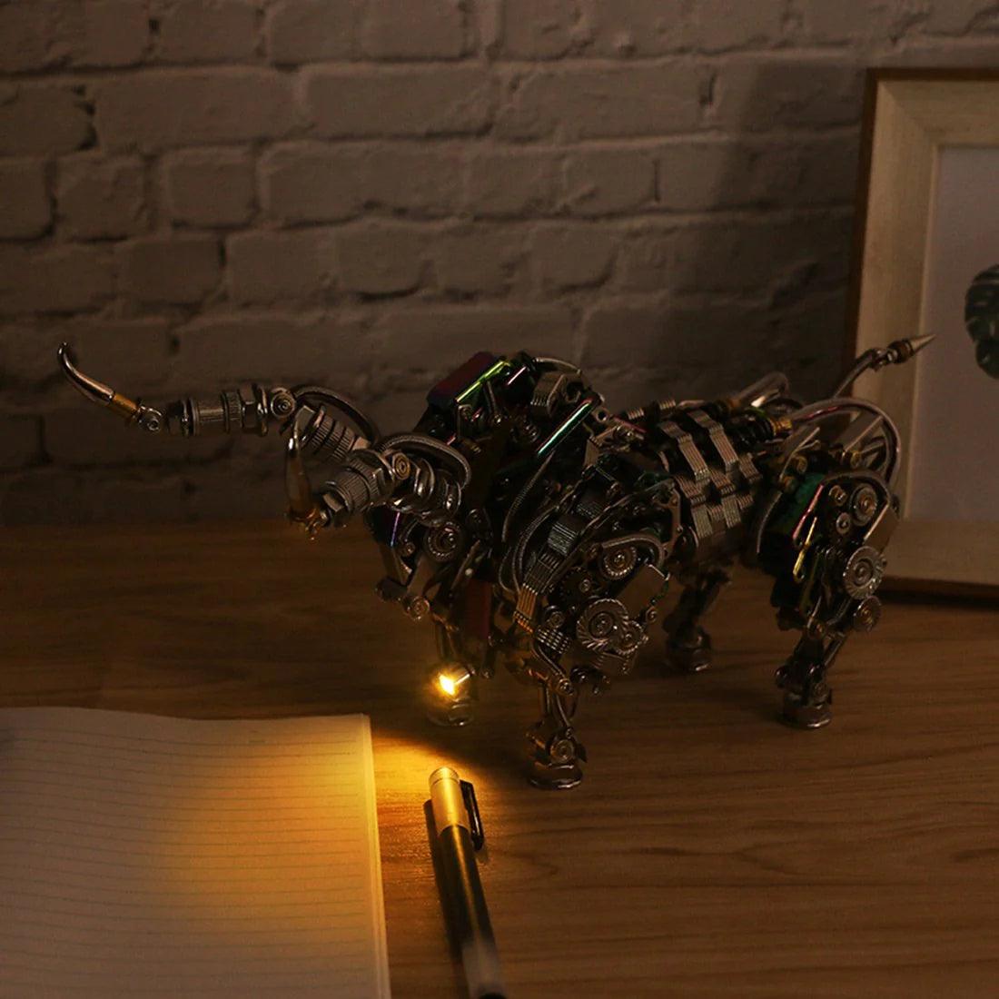 Two mechanical metal bull models displayed together on a desk, articulated 1087 piece animal kits and gifts for collectors Silver, Gold