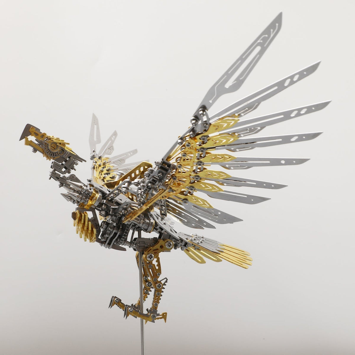 Gold accented metal eagle kit with movable wings and laser cut feathers for a steampunk shelf and office display Gold Eagle