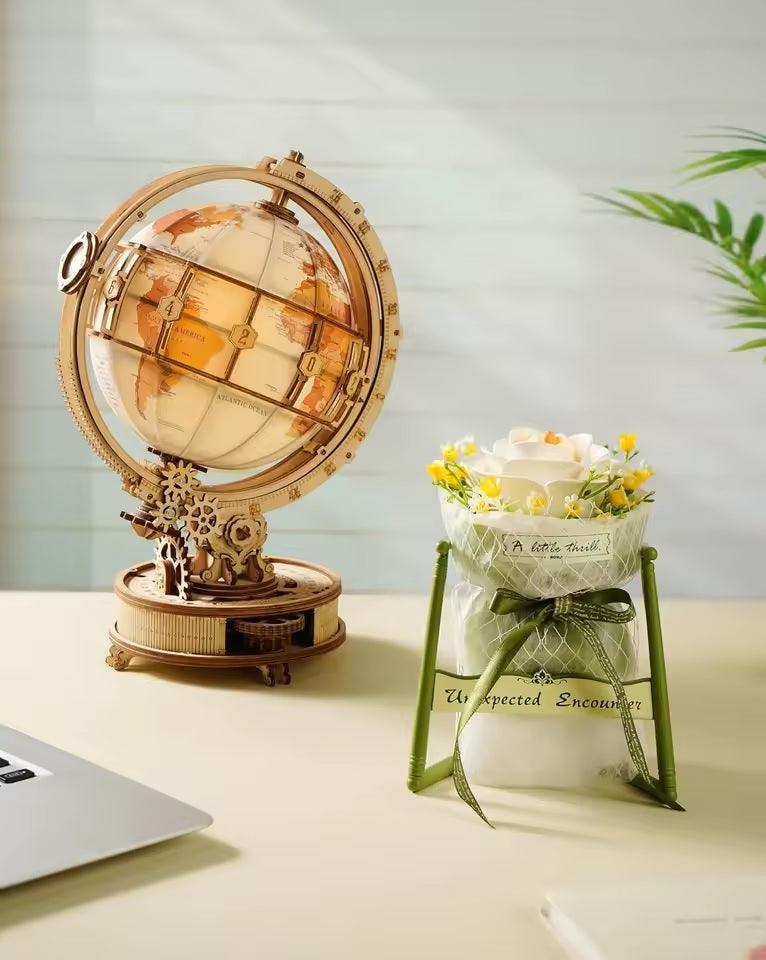 White camellia wooden flower puzzle as calming botanical desk decor beside a wooden model display collection AF021