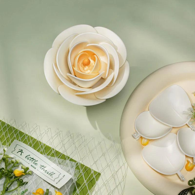 Cream white camellia bloom crafted from laser-cut wooden petals, a lasting flower that needs no water or care AF021