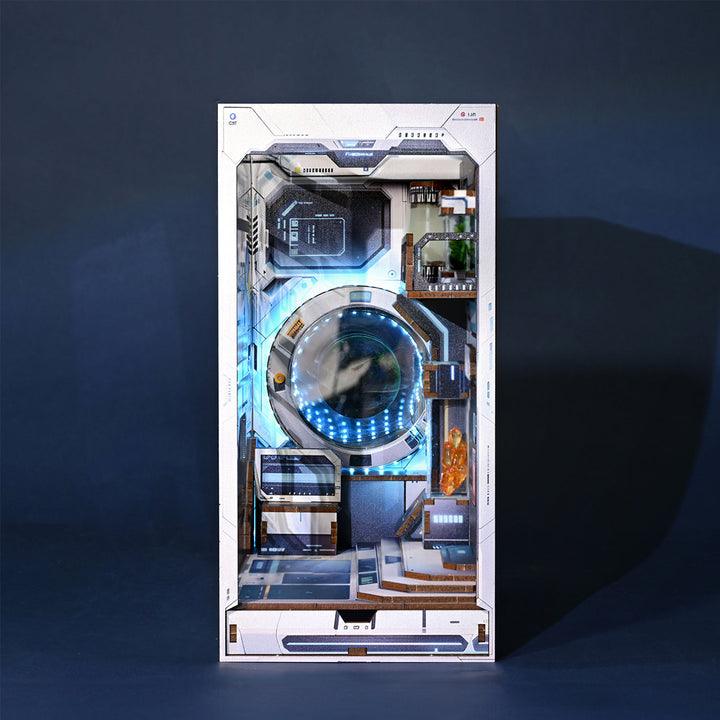 Assembled space diorama with a glowing time machine tunnel portal and an astronaut figure lighting a shelf display