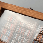 Mini bookshelf you sort and arrange by color for a mindful non screen reset and calming break at a home office desk