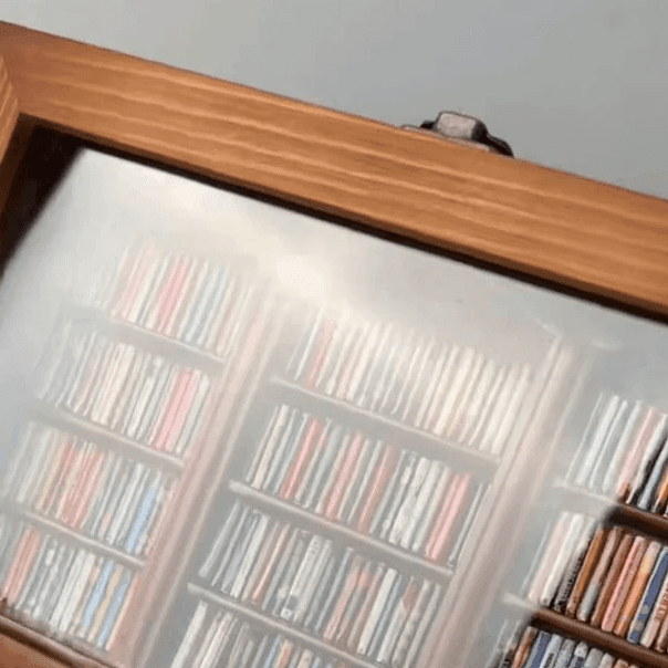 Mini bookshelf you sort and arrange by color for a mindful non screen reset and calming break at a home office desk