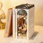 Wooden book nook diorama with an iron arch, Roman columns and a glass roof over a romantic cafe balcony scene