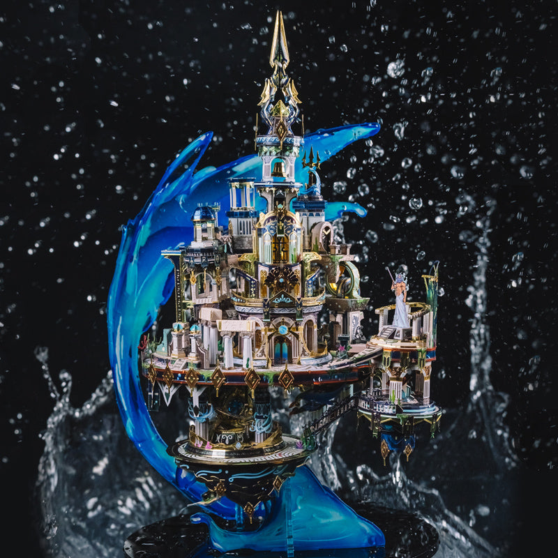 Stainless steel and gold brass Atlantis city model with a cresting wave and spire, a fantasy display piece for adult builders