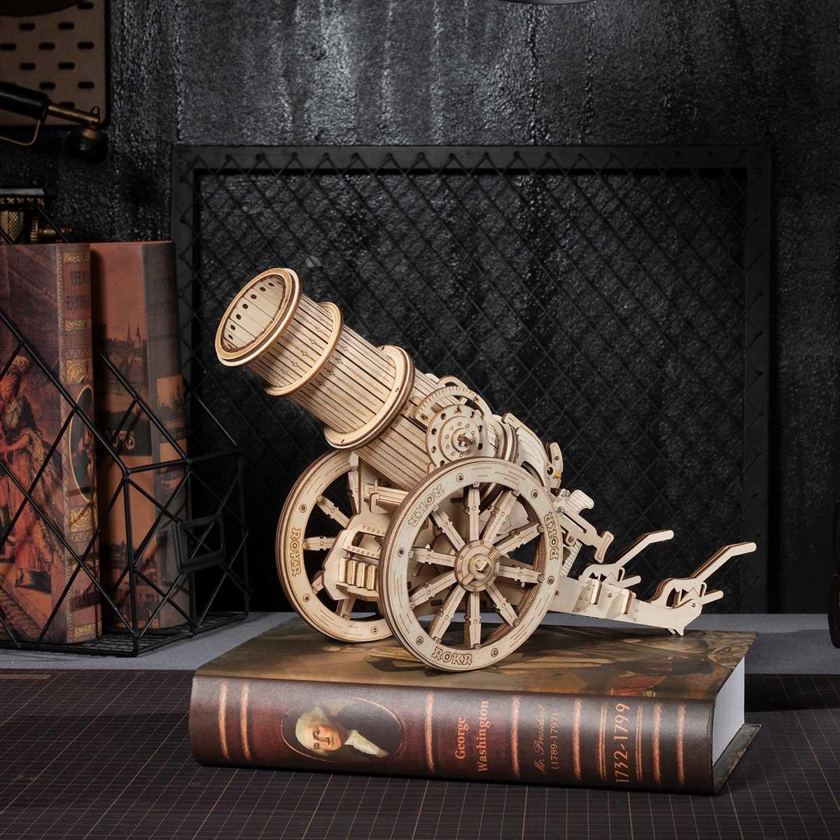 Assembled wooden siege weapon model on a shelf, rubber band powered catapult and conversation piece for a home office
