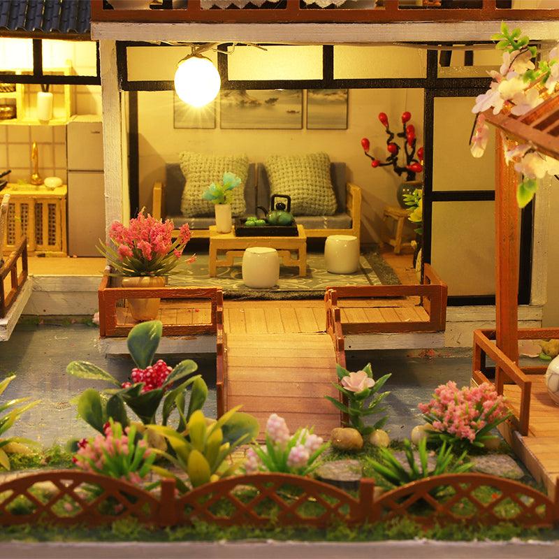Bamboo courtyard miniature dollhouse kit at 1:24 scale, an illuminated Asian garden model with a patio and footbridge to build