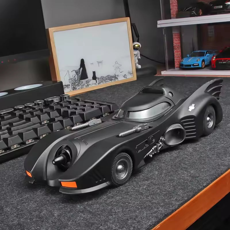 1989 Batman movie car diecast model styled on a home office desk for collectors of iconic Gotham vehicle replicas 1989 Black version.