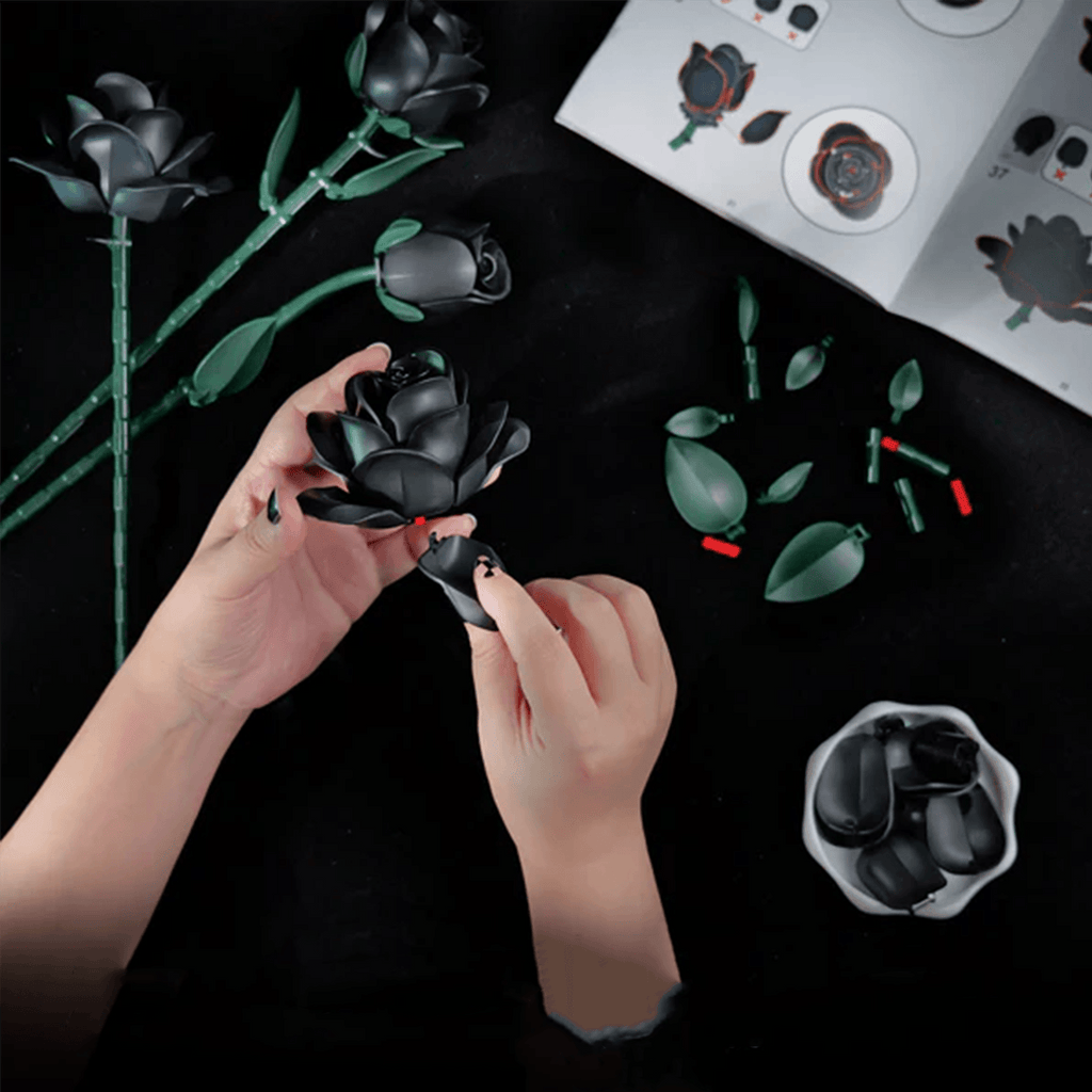 Black rose bouquet building set with LED glow and iridescent coating, mindful adult craft and mantel decor, in 3 rose and 12 rose sets