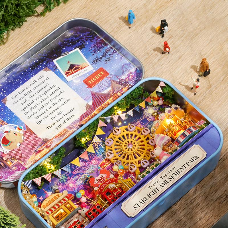 Illuminated amusement park box theater dollhouse kit with a ferris wheel and carousel set in a Blue keepsake tin