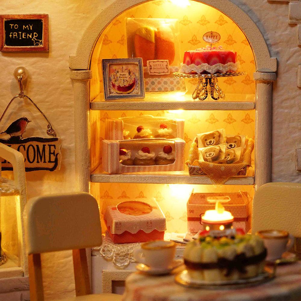 1:24 patisserie diorama with LED-lit shelves of birthday cakes and pastries, a miniature cake shop kit for desk decor
