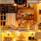 Miniature cake shop model with a printed dessert menu, tea tins, and cupcakes, a 1:24 bakery dollhouse kit for teens