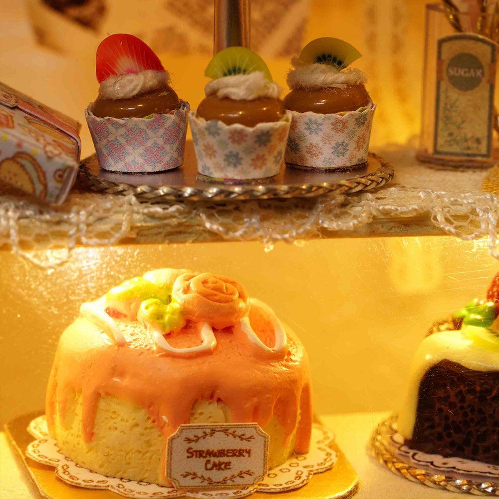 Tiny resin strawberry cake and cupcakes on display, a 1:24 miniature bakery dollhouse kit and craft gift for bakers