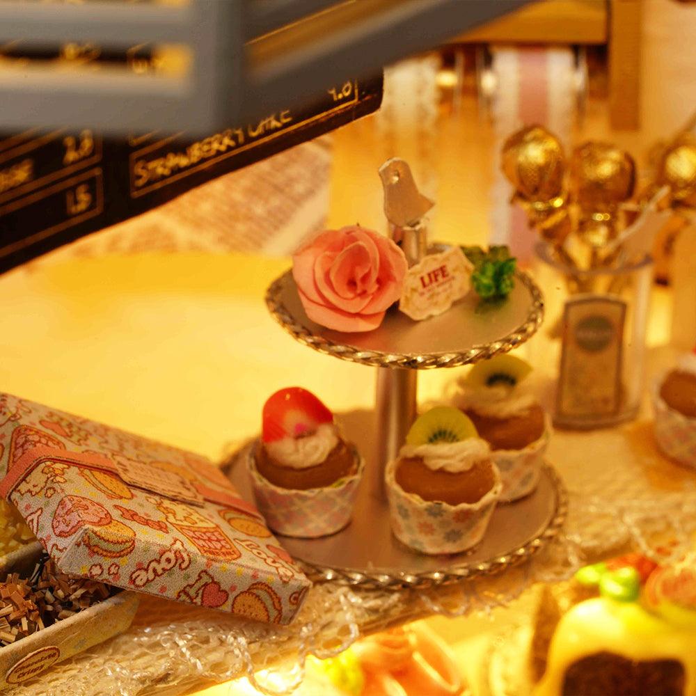 Miniature tiered cake stand with resin cupcakes and a rose, a 1:24 bakery diorama kit for bookshelf and desk display