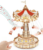 Touch activated wooden music box carousel that starts the lights, motion, and melody from one hidden switch