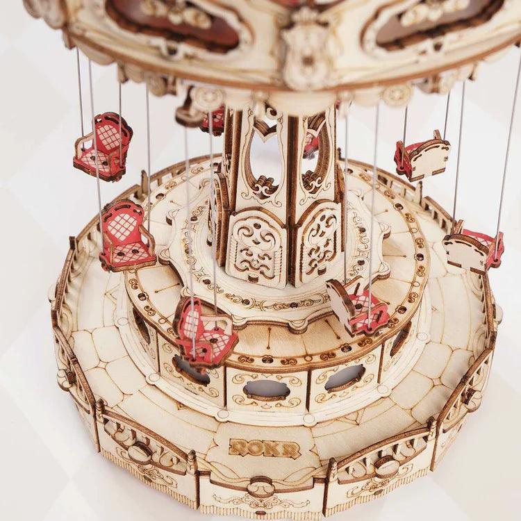 Laser cut carousel model with illuminated hollow side panels that glow, a lit centerpiece for a shelf or desk
