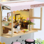 Little cafe window counter with a vintage coffee grinder, gold kettle and pink roses, a charming 1:24 scale model to assemble