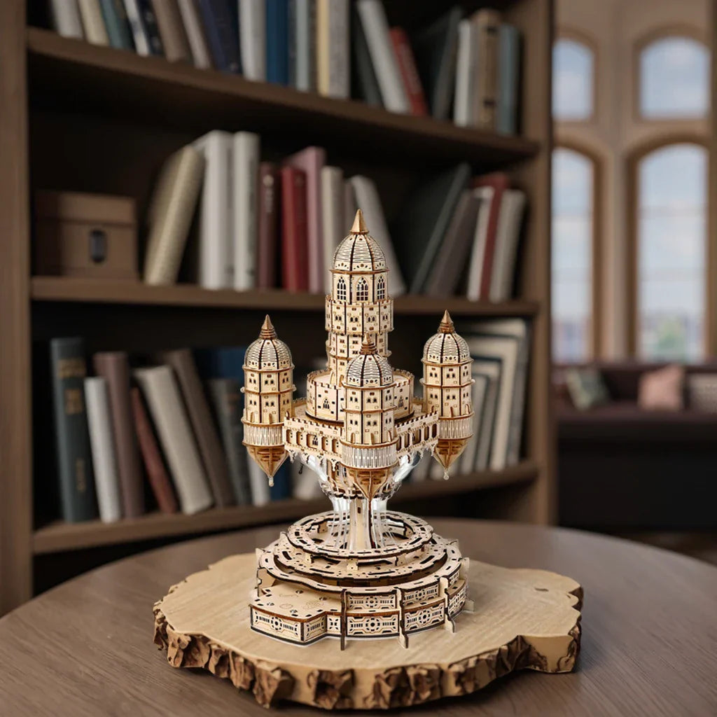 Celestia Castle music box puzzle glowing with warm LED lights as a study shelf centerpiece for castle and model fans