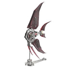 Red translucent winged angelfish metal model kit assembled on a display stand, a 500 piece stainless steel desk sculpture. Red