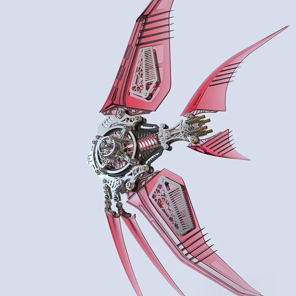 Red translucent angelfish wings over an exposed metal mechanism, a 500 piece stainless steel model kit for collectors. Red