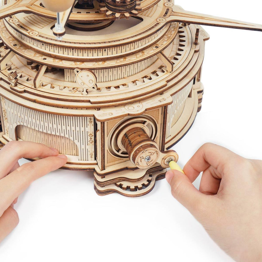 Assemble the hand-crank gear mechanism of this wooden orrery, a 316 piece 3D astronomy puzzle for adults and teens Deluxe Wooden Orbital Precision Wooden Classic