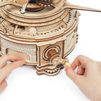 Assemble the hand-crank gear mechanism of this wooden orrery, a 316 piece 3D astronomy puzzle for adults and teens Deluxe Wooden Orbital Precision Wooden Classic