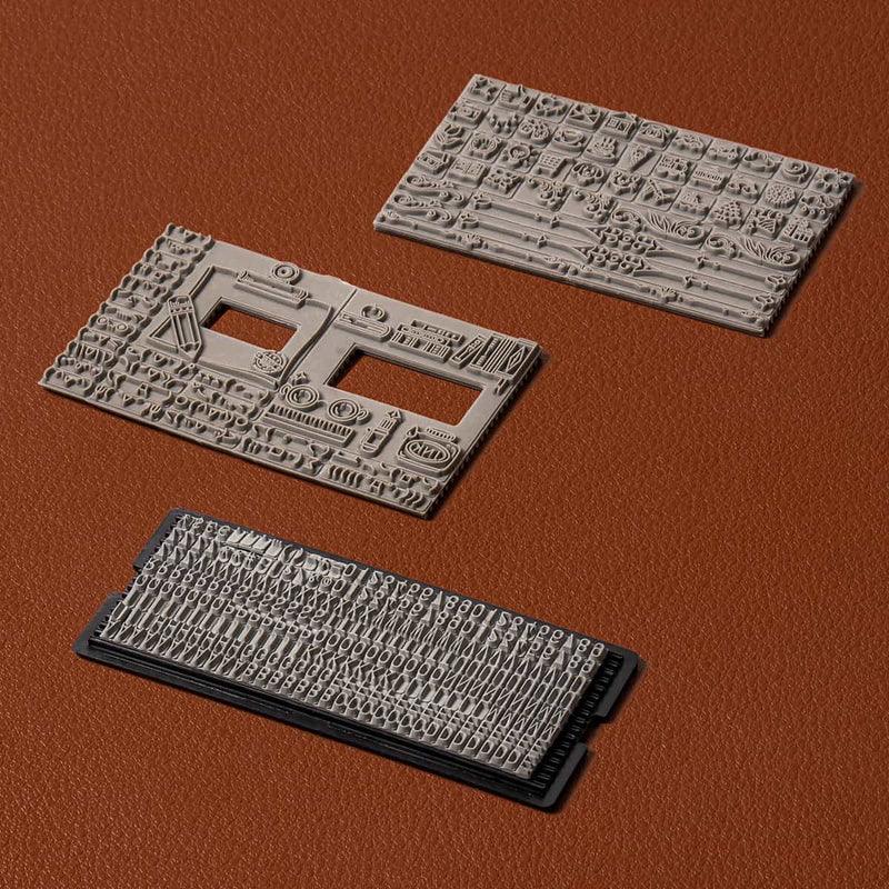 Moveable-type letter tiles and rubber design plates for a wooden printing press kit used in card making and journaling crafts