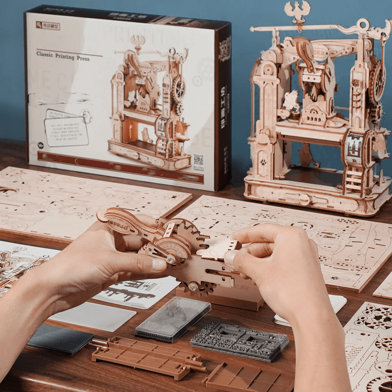 Glue-free 300 piece wooden model kit assembling into a working printing press, a hands-on STEM building project and gift idea