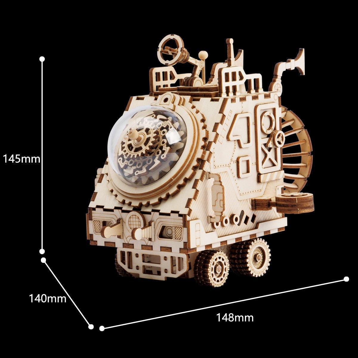Steampunk spaceship model covered in brass gears and pipes, a Victorian wooden kit and desk display for steampunk fans