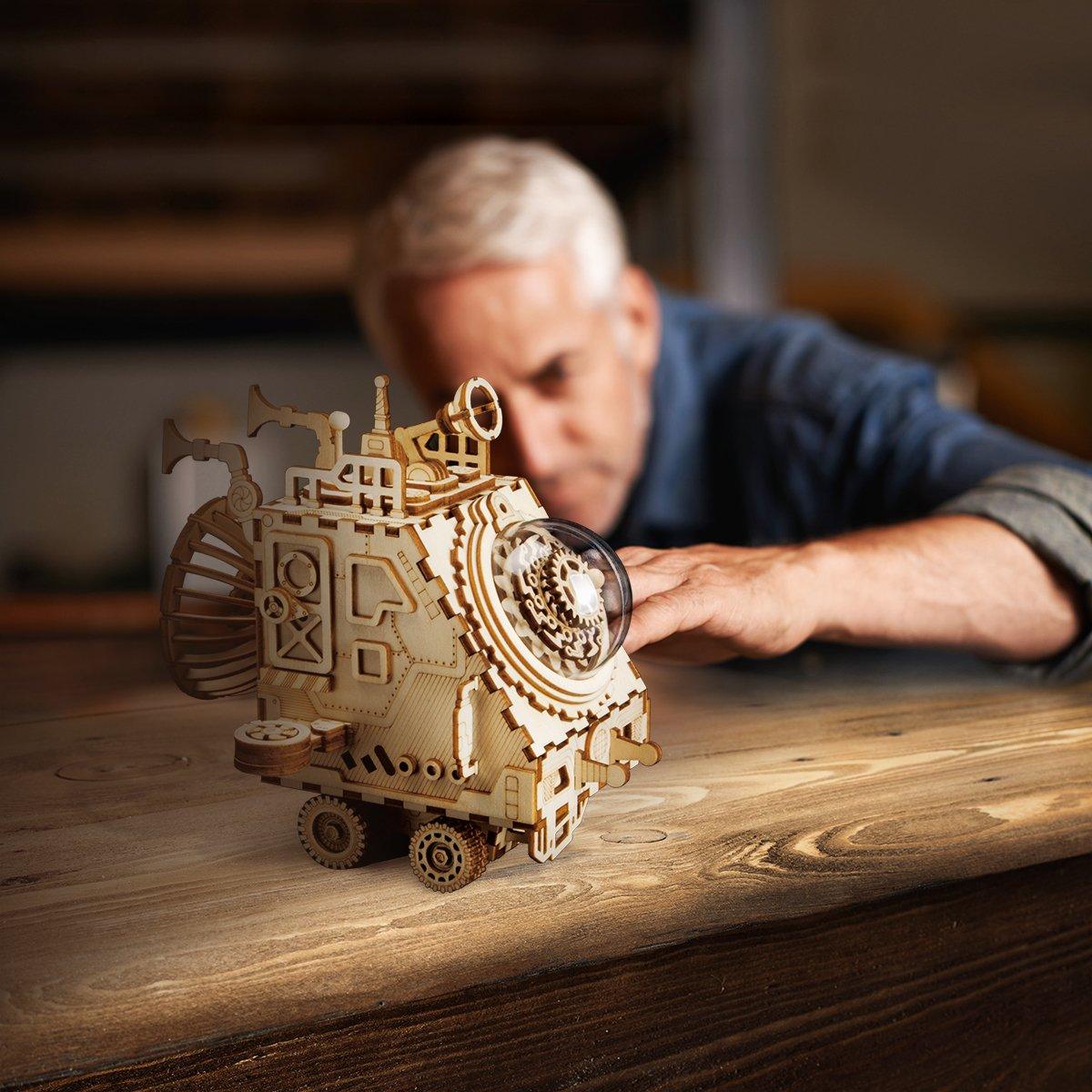 Steampunk music box spaceship shown to scale as desk decor, a holiday and birthday gift for collectors and builders 14 and up